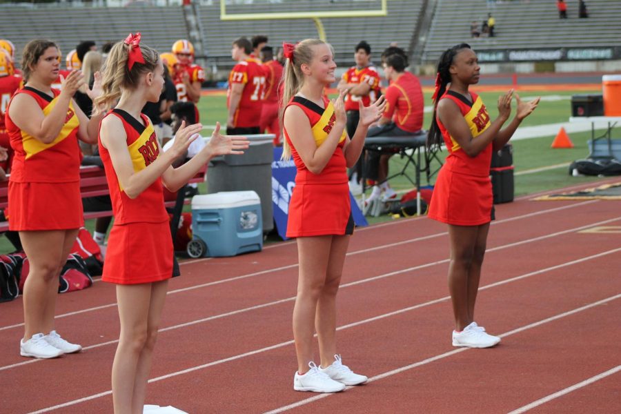 The freshmen cheerleading squad works hard to inspire the Rocks during a home game. 