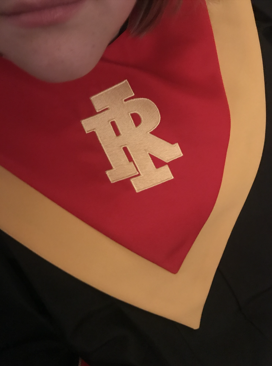 The Rock Island High School Logo on the choir robes represent the pride that choir students have and carry with them when they sing on stage as a Rock Island High School student.
